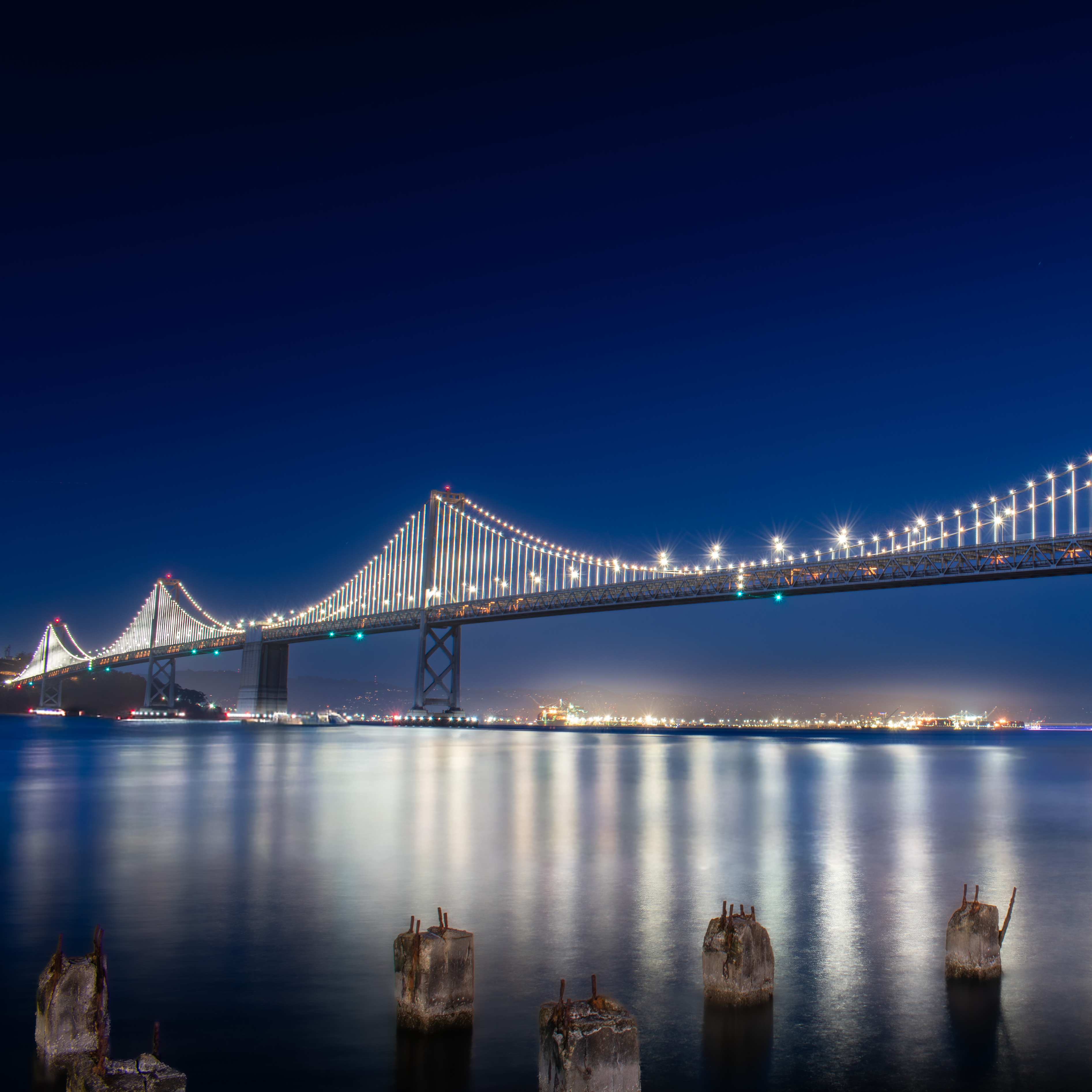 The Bay Bridge lit up at night.